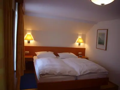 Ein Bett oder Betten in einem Zimmer der Unterkunft Hotel Deutsches Haus