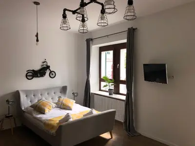 Ein Bett oder Betten in einem Zimmer der Unterkunft Boutique-Hotel „Altes Rathaus“