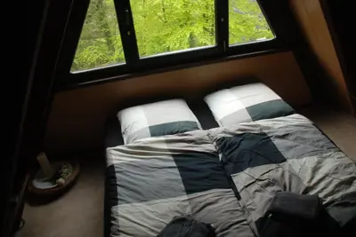 Ein Bett oder Betten in einem Zimmer der Unterkunft Eifelwolke