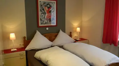 Ein Bett oder Betten in einem Zimmer der Unterkunft Gastehaus am Calmont
