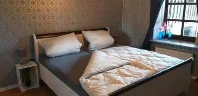 Ein Bett oder Betten in einem Zimmer der Unterkunft FeWo Am Marktplatz