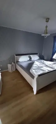 Ein Bett oder Betten in einem Zimmer der Unterkunft FeWo Am Marktplatz