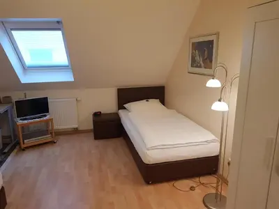 Ein Bett oder Betten in einem Zimmer der Unterkunft Ferienhaus am Rheintor
