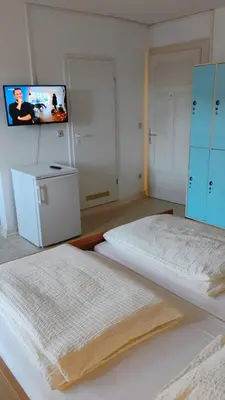 Ein Bett oder Betten in einem Zimmer der Unterkunft Hotel Kremer