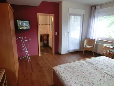 Ein Bett oder Betten in einem Zimmer der Unterkunft Ferienweingut Hirschen Schulstraße