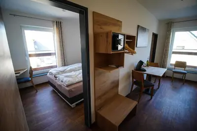 Ein Bett oder Betten in einem Zimmer der Unterkunft Nürburgring Aparts