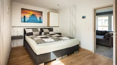 Ein Bett oder Betten in einem Zimmer der Unterkunft FeWo-tt 2