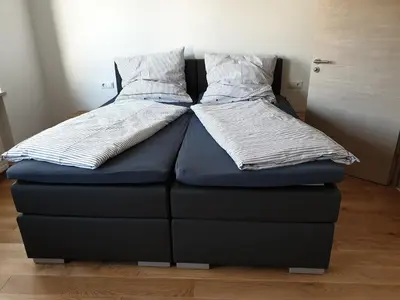 Ein Bett oder Betten in einem Zimmer der Unterkunft Beim Hooch. Egon