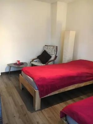 Ein Bett oder Betten in einem Zimmer der Unterkunft Ferienwohnung Helga