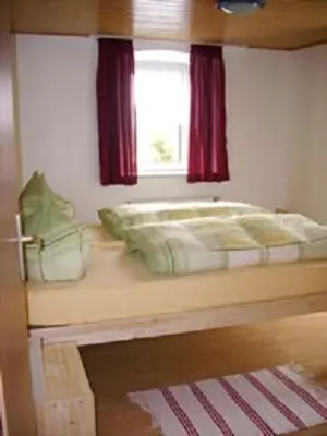 Ein Bett oder Betten in einem Zimmer der Unterkunft Ferienhaus Neunkirchener- Mühle
