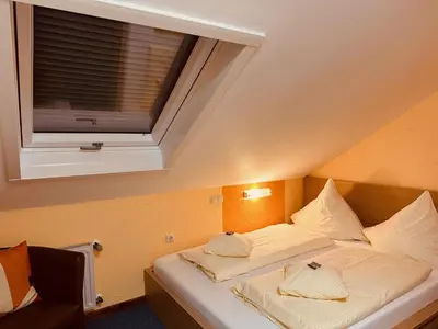 Ein Bett oder Betten in einem Zimmer der Unterkunft Hotel Cafe Restaurant Loreleyblick