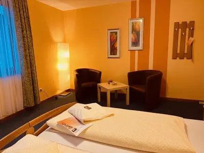 Ein Bett oder Betten in einem Zimmer der Unterkunft Hotel Cafe Restaurant Loreleyblick