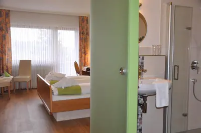 Ein Bett oder Betten in einem Zimmer der Unterkunft Hotel-Restaurant Sonnenhof
