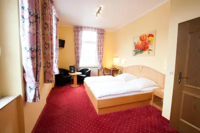 Ein Bett oder Betten in einem Zimmer der Unterkunft Hotel Zwei Mohren