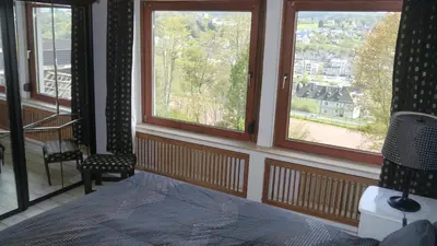 Ein Bett oder Betten in einem Zimmer der Unterkunft Vulkaneifel-Ferienwohnungen am Felsenpfad