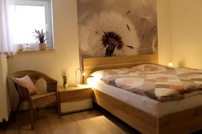 Ein Bett oder Betten in einem Zimmer der Unterkunft Ferienwohnung Im Bachtal