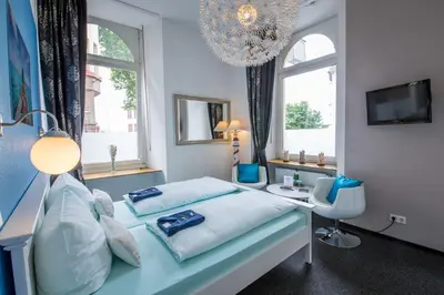 Ein Bett oder Betten in einem Zimmer der Unterkunft Aparthotel am Münzplatz
