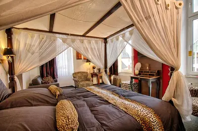 Ein Bett oder Betten in einem Zimmer der Unterkunft Aparthotel am Münzplatz