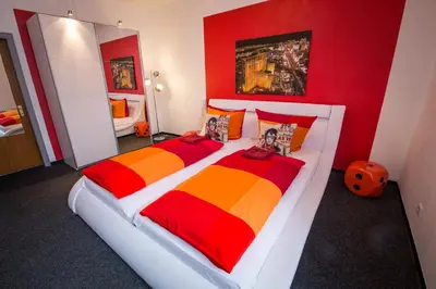 Ein Bett oder Betten in einem Zimmer der Unterkunft Aparthotel am Münzplatz