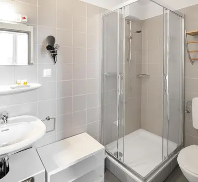 Ein Badezimmer in der Unterkunft Aparthotel am Münzplatz