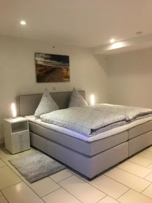 Ein Bett oder Betten in einem Zimmer der Unterkunft Ferienwohnung Helmut Beisiegel