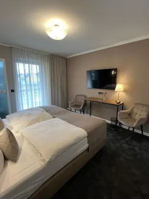 Ein Bett oder Betten in einem Zimmer der Unterkunft Hotel Zum Fährturm