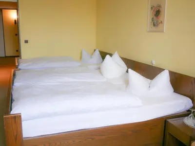 Ein Bett oder Betten in einem Zimmer der Unterkunft Hotel Oronto