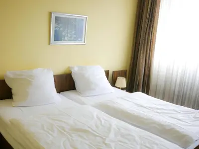Ein Bett oder Betten in einem Zimmer der Unterkunft Hotel Oronto