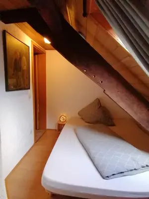 Ein Bett oder Betten in einem Zimmer der Unterkunft Ferienwohnung Flämisches Weinhaus