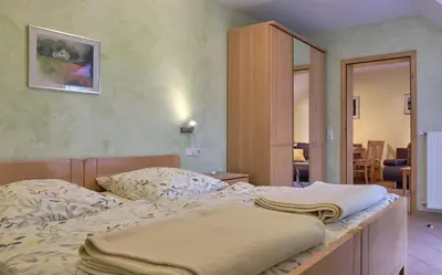 Ein Bett oder Betten in einem Zimmer der Unterkunft 4 Kreuzstraße Laaschhof