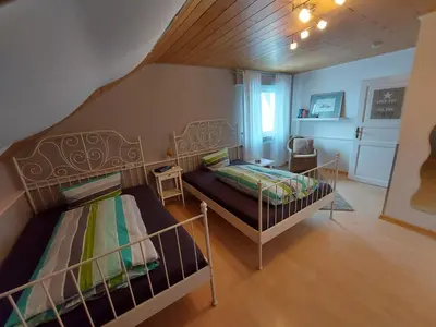 Ein Bett oder Betten in einem Zimmer der Unterkunft Ferienwohnung am Lieserpfad