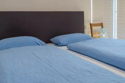 Ein Bett oder Betten in einem Zimmer der Unterkunft Das Blaue Haus - Ferienhaus