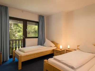 Ein Bett oder Betten in einem Zimmer der Unterkunft Holiday Home Eifelnatur - Haus 2-4 by Interhome