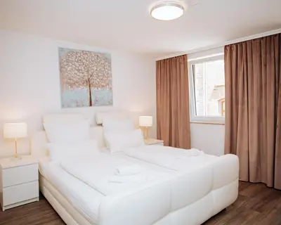 Ein Bett oder Betten in einem Zimmer der Unterkunft Ferienhaus Moselpromenade