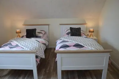 Ein Bett oder Betten in einem Zimmer der Unterkunft Ferienhaus Eifel-Charme