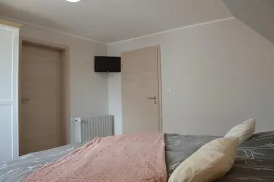 Ein Bett oder Betten in einem Zimmer der Unterkunft Ferienhaus Eifel-Charme