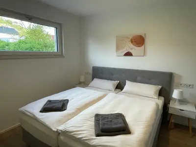 Ein Bett oder Betten in einem Zimmer der Unterkunft Ferienbungalow Kampenheissji