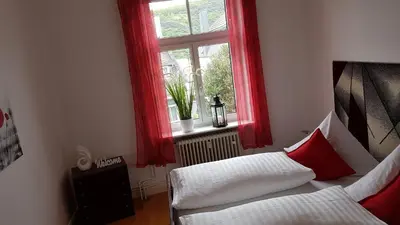 Ein Bett oder Betten in einem Zimmer der Unterkunft White House (1f) Boppard City