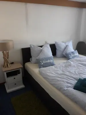 Ein Bett oder Betten in einem Zimmer der Unterkunft Rathausschenke Münstermaifeld