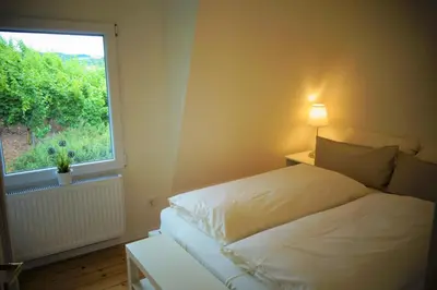 Ein Bett oder Betten in einem Zimmer der Unterkunft Ferienhaus am Moselsteig