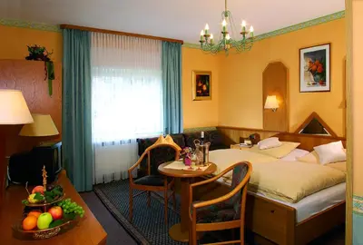 Ein Bett oder Betten in einem Zimmer der Unterkunft Gästehaus Hotel Rheingraf