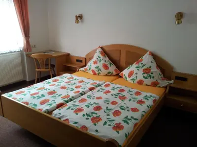 Ein Bett oder Betten in einem Zimmer der Unterkunft Moselhotel Waldeck