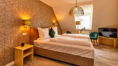 Ein Bett oder Betten in einem Zimmer der Unterkunft Rochter Landhotel