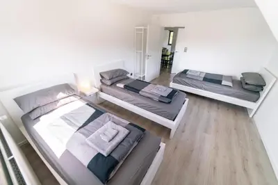 Ein Bett oder Betten in einem Zimmer der Unterkunft North Loop Rooms
