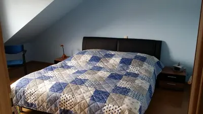 Ein Bett oder Betten in einem Zimmer der Unterkunft Ferienwohnung Am Frankenbach