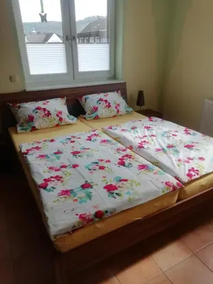Ein Bett oder Betten in einem Zimmer der Unterkunft Ferienwohnung Hermann