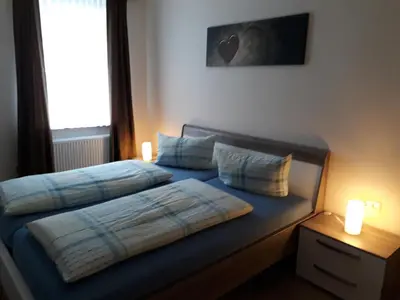 Ein Bett oder Betten in einem Zimmer der Unterkunft Pension / Ferienwohnungen Scheid