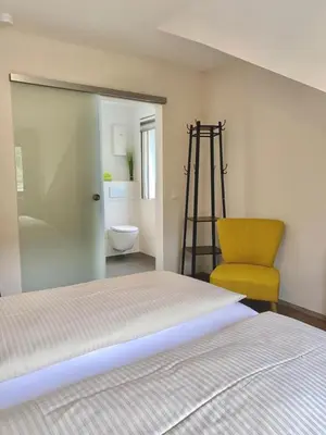 Ein Bett oder Betten in einem Zimmer der Unterkunft Pension / Ferienwohnungen Scheid