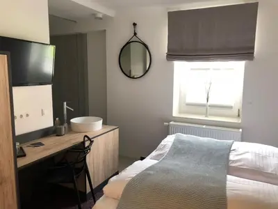 Ein Bett oder Betten in einem Zimmer der Unterkunft Weinhaus Fries
