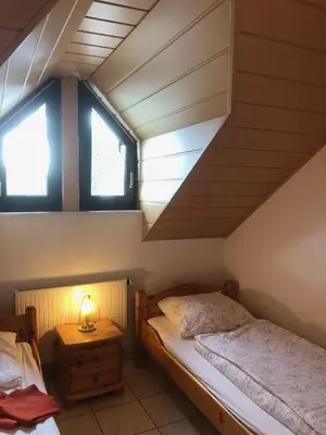 Ein Bett oder Betten in einem Zimmer der Unterkunft Ferienwohnung Irmgard Ewald